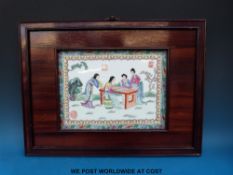 A Chinese porcelain plaque in hardwood frame with enamelled figural decoration (37 x 50cm including