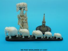 An Indian ivory carving of a young couple under a tree (approx 10cm tall) together with an ivory