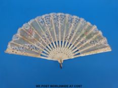 A 19thC carved bone and lace fan with hand-decorated scene of a couple and two scenes of flowers