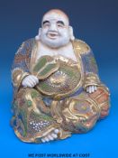A Japanese Satsuma figure of hotei with gilt and enamelled decoration (25cm tall)