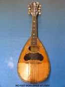 A late 19thC bowl-backed mandolin with mother-of-pearl and coloured wood inlay by Joseph Bohmann.