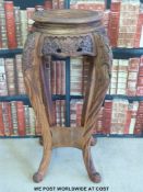 A Chinese carved wooden table / jardiniere stand (91cm tall,