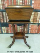 A Regency mahogany four division teapoy of sarcophagus shape,