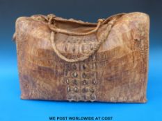 A large vintage crocodile skin holdall