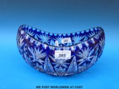 A blue overlaid cut glass boat shaped bowl,