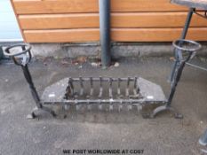 A wrought iron fire grate