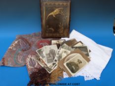 A leather-bound late 19thC or early 20thC photograph album together with a crochet and embroidered