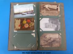 A postcard album containing over 120 postcards including WWI era, Louis Wain, McGill,