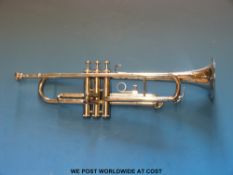 A cased silver plated trumpet by Trister India