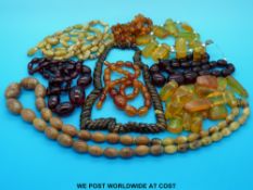 Two bakelite beaded necklaces, two translucent amber necklaces,