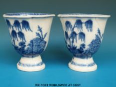 A pair of 18thC Chinese blue and white custard cups with landscape and pagoda decoration (10.