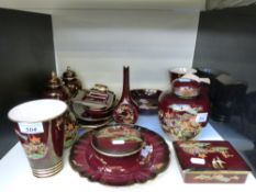 A collection of Carlton ware Mikado / Pagoda and other patterned ware against a burgundy ground