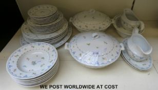 A six setting Royal Worcester dinner service in Ribbons and Bows pattern including meat dish,