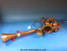 A bugle with lanyard cord together with a coaching horn and one other