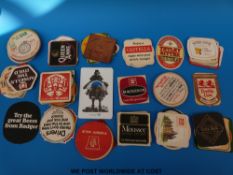 A collection of English and European beer mats,