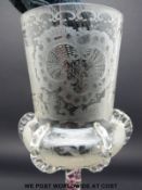 A 19thC Bohemian clear glass goblet etched to the body with hunting scenes among scrolling