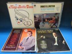 A collection of vinyl LP's including swing, jazz, banjo, Frank Sinatra, Bette Davis,
