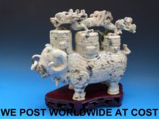 A large Chinese jadeite figural lidded vase and cover in the form of an archaistic buffalo,