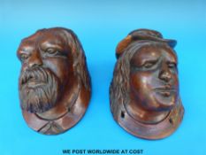 A pair of carved Black Forest heads