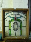 A stained glass window in wooden frame (h68cm)