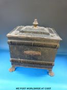 An Art Nouveau style coal box raised on lion paw feet