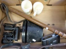 A wooden truncheon, folding camera,