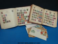 Two Strand albums of all world stamps,