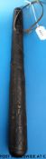 A bog oak carved truncheon with carved clover leaf decoration, 41cm long.