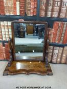 A mahogany swing frame mirror (height 62cm)