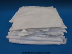 A collection of vintage linen and other lace-edged tablecloths