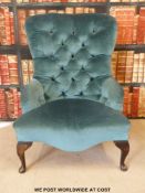 A button-back nursing chair raised on cabriole front legs