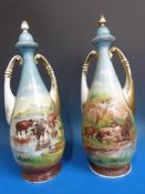 A pair of hand-painted urns decorated with cattle (40cm tall)