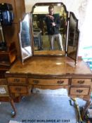 A burr walnut dressing table with triptych mirror to rear (w107 x d50 x h153cm)