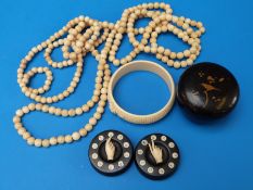 Two 19thC ivory necklaces, ivory whist/bridge marker, ivory bracelet,