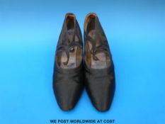 A pair of 1920s silk lady's shoes with inlaid rhinestones to the heels (London Shoe Company Ltd)