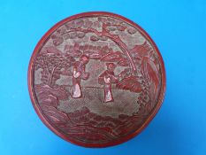 A Chinese circular cinnabar lacquer box with carved figural scene to top and carved geometric