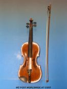 A c1900 violin with single piece flame back, complete with bow and case (37cm back),