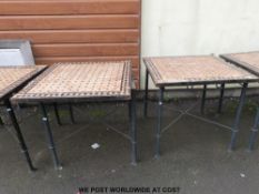 Four tile-topped conservatory or garden tables