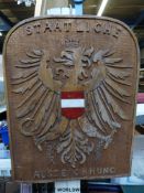 A carved wooden Austrian national award plaque with national arms to centre,