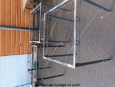 Three tile-topped conservatory or garden tables