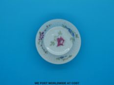 A Chinese Qianlong mark and period ink pot decorated with various flowers on a moulded body (7.