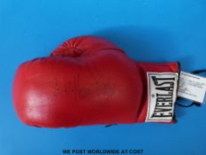 A signed Sir Henry Cooper boxing glove with certificate