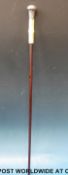 A conductor's baton with wooden shaft, ivory handle and silver knop (Ldn 1888),