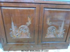 A Chinese dark elm low cupboard with canted corners,