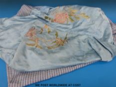 An embroidered silk throw with foliate embroidered decoration (244x240cm)