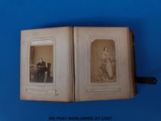 A leather bound album of mainly 19thC studio photographs including Queen Victoria and other members