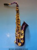An Ferris tenor saxophone in purple finish with original case