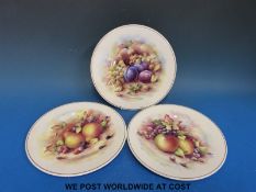 Three Doulton fruit plates signed D Wallace (9in diameter)