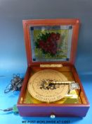 A Thoren electric powered music box playing plastic discs,