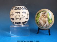 Two painted African ostrich eggs,